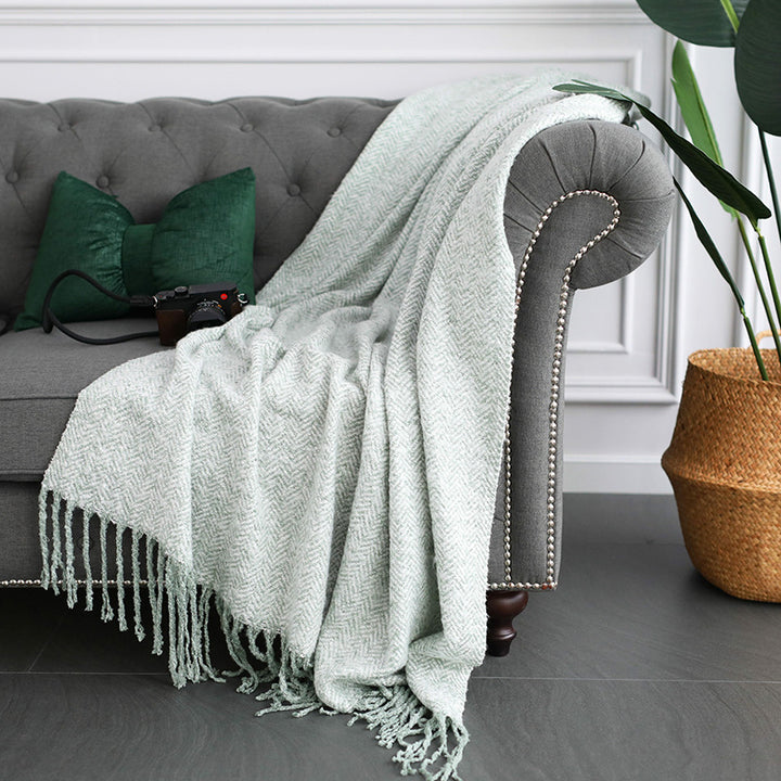 Throw blanket and plaid with herringbone structure, soft cotton blend and decorative fringes