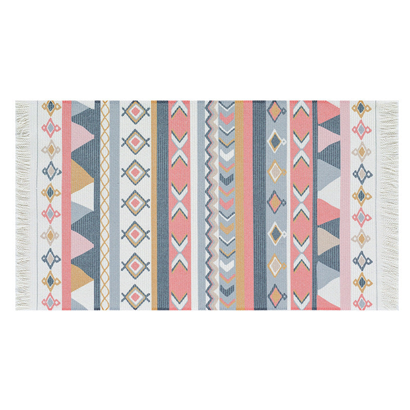 Flat-woven runner rug in ethnic stripe design with hand-fringed edge