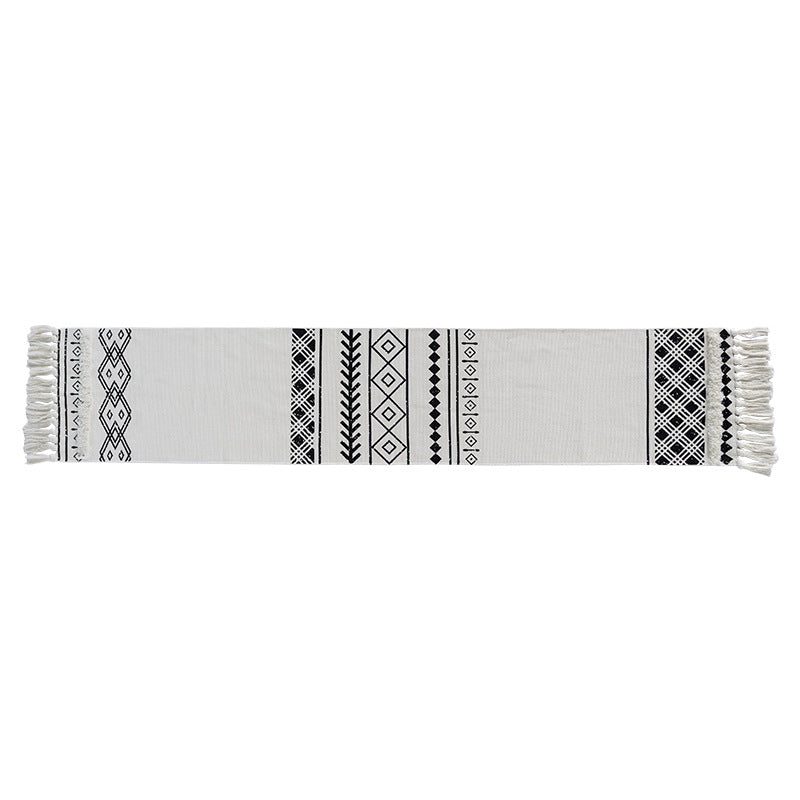 Boho table runner made of cotton blend with woven ethnic jacquard and decorative fringes
