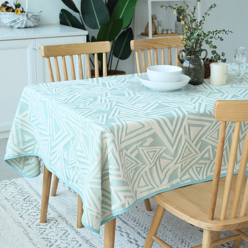Woven jacquard tablecloth made of cotton blend with geometric triangle design