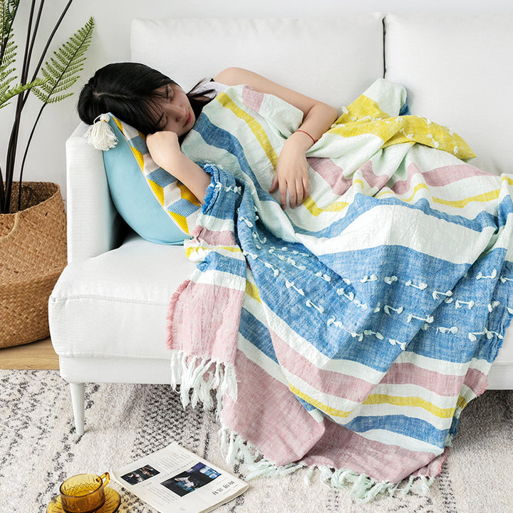 Light striped cotton throw blanket with fringes and textured knot appliqué
