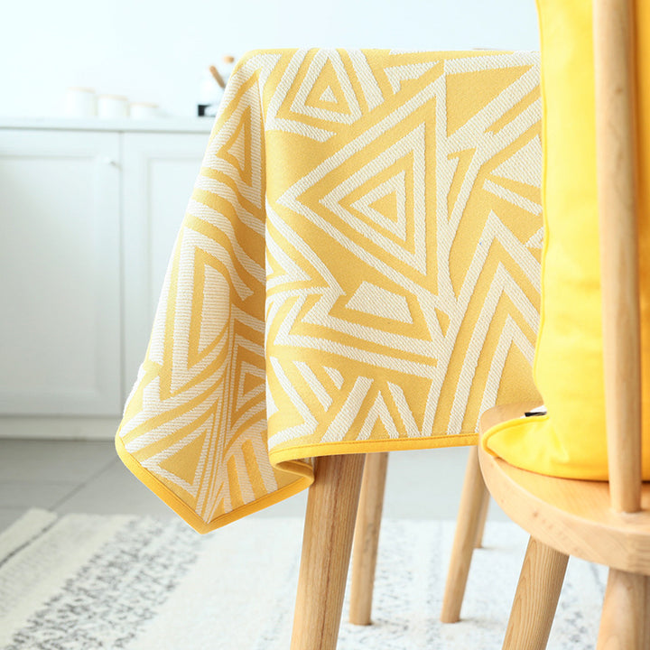Woven jacquard tablecloth made of cotton blend with geometric triangle design