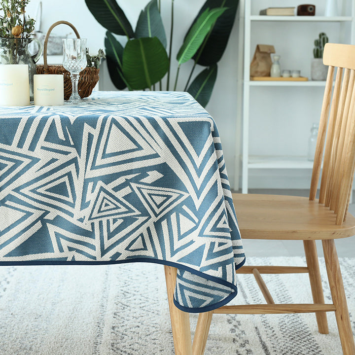 Woven jacquard tablecloth with geometric triangle pattern and easy-care cotton blend