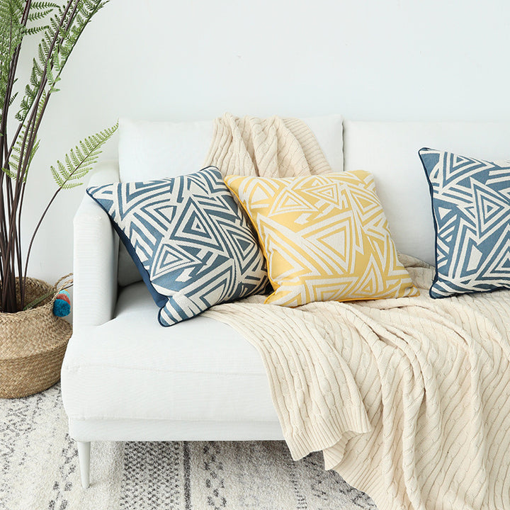 Square cushion cover with double-sided jacquard triangle motif and piping