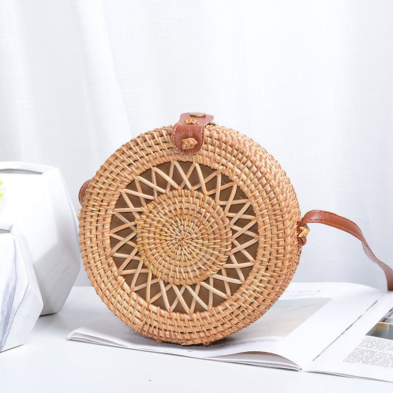 Elegant round handbag made of woven rattan