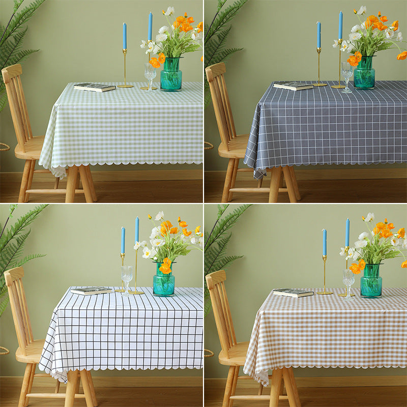 Wipeable tablecloth with fine check pattern, wavy hem and easy-care PVC finish