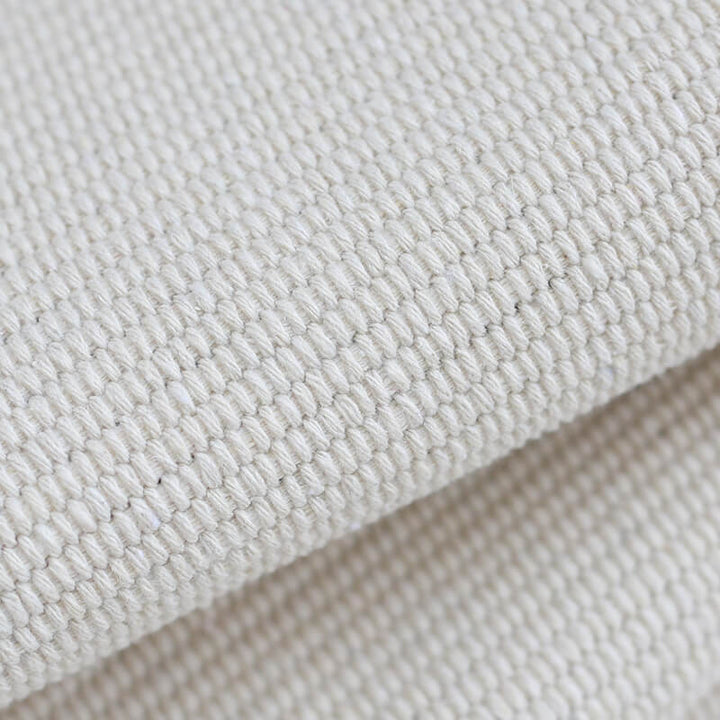 Woven decorative runner made of cotton blend with ethnic diamond pattern and fringes