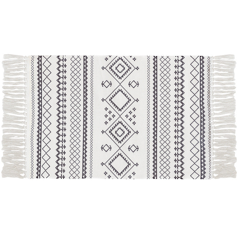 Flat-woven cotton carpet runner with ethnic diamond pattern and decorative fringes