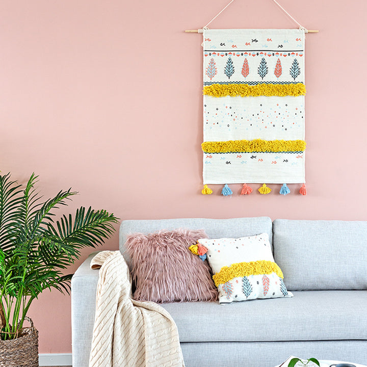 Wall tapestry in Scandi-Boho style with tufting stripes, tassels, and wooden rod