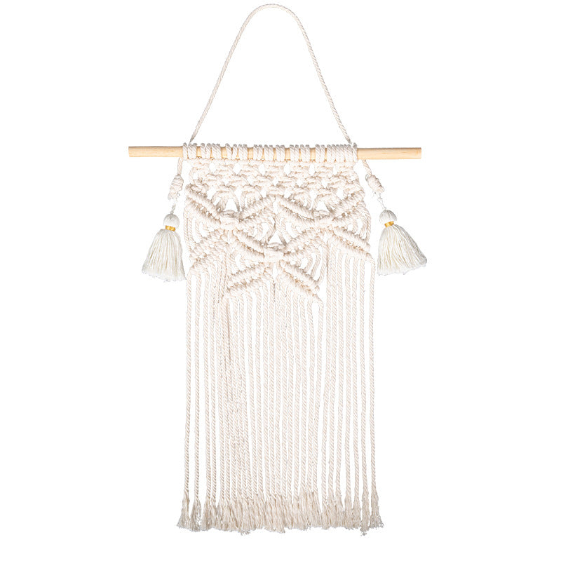 Macramé wall hanging with geometric triple tassel design and wooden rod