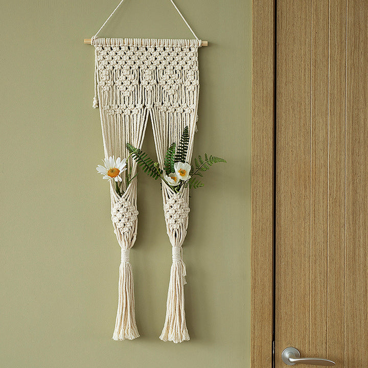 Macramé wall hanging with geometric triple tassel design and wooden rod
