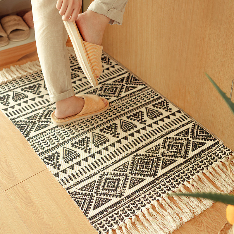 Flat-woven cotton blend runner with ethnic diamond jacquard and fringes