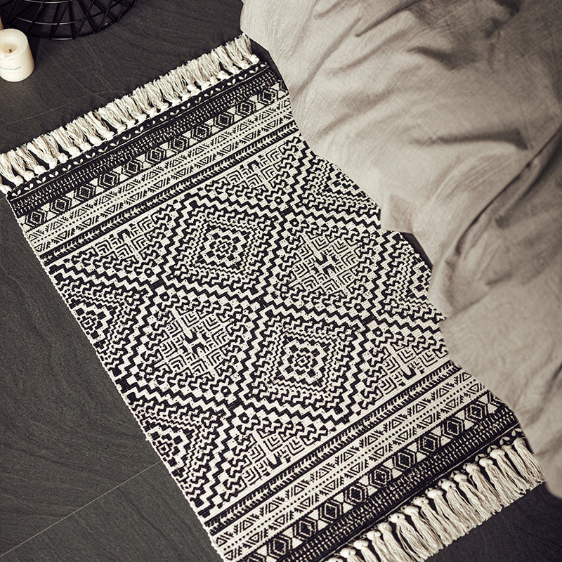 Flat-woven cotton blend runner with ethnic diamond jacquard and fringes
