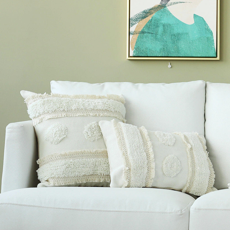 Decorative woven cushion cover with tufted circle applications and textured cotton surface