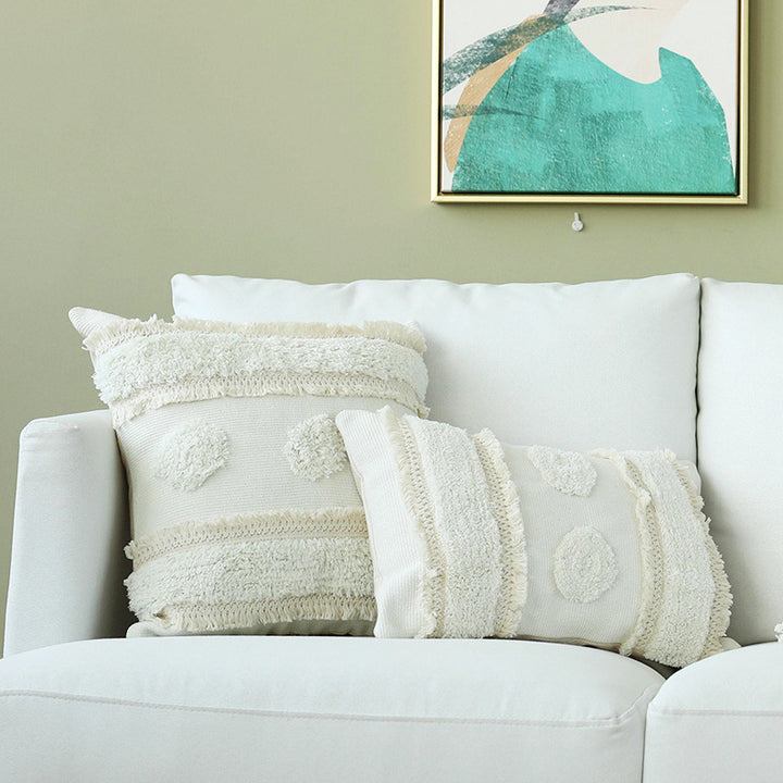 Decorative woven cushion cover with tufted circle applications and textured cotton surface