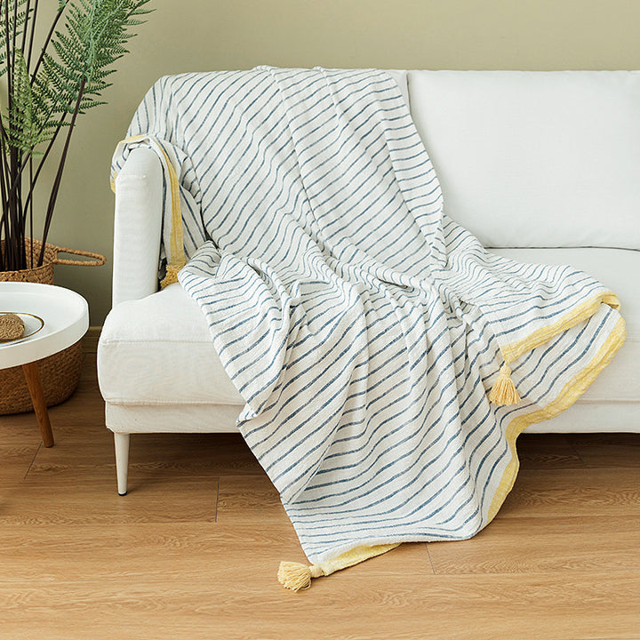 Light striped cotton throw blanket with fringes and textured knot appliqué