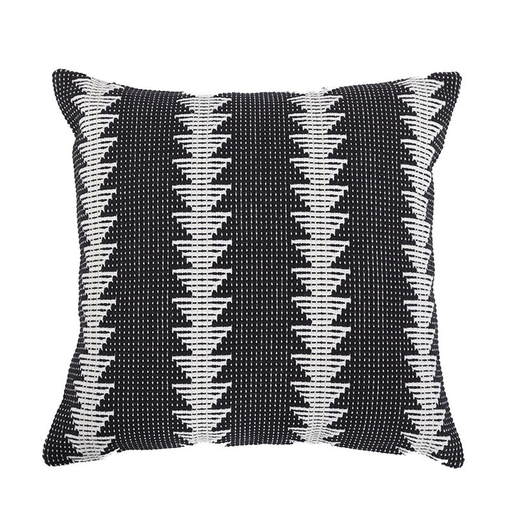 Square woven decorative cushion cover in tribal jacquard with pom-pom corners
