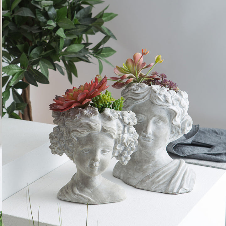 Artistic head sculpture flower pot