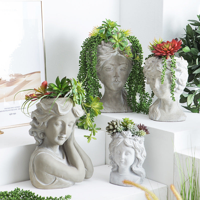 Artistic head sculpture flower pot