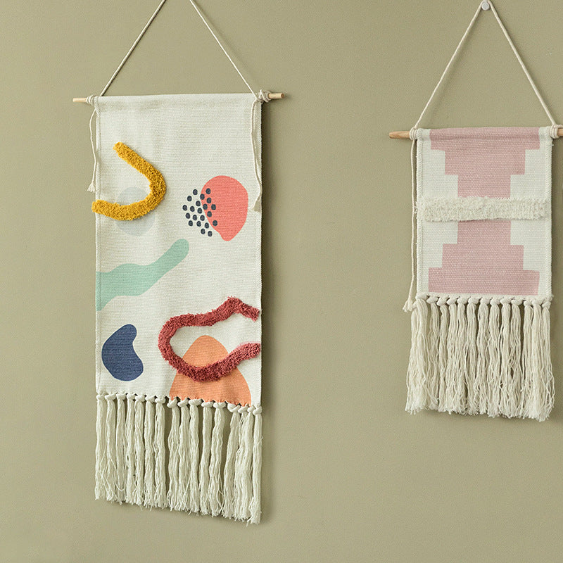 Hand-woven wall hanging and table runner made of cotton blend with geometric staircase pattern and long fringes