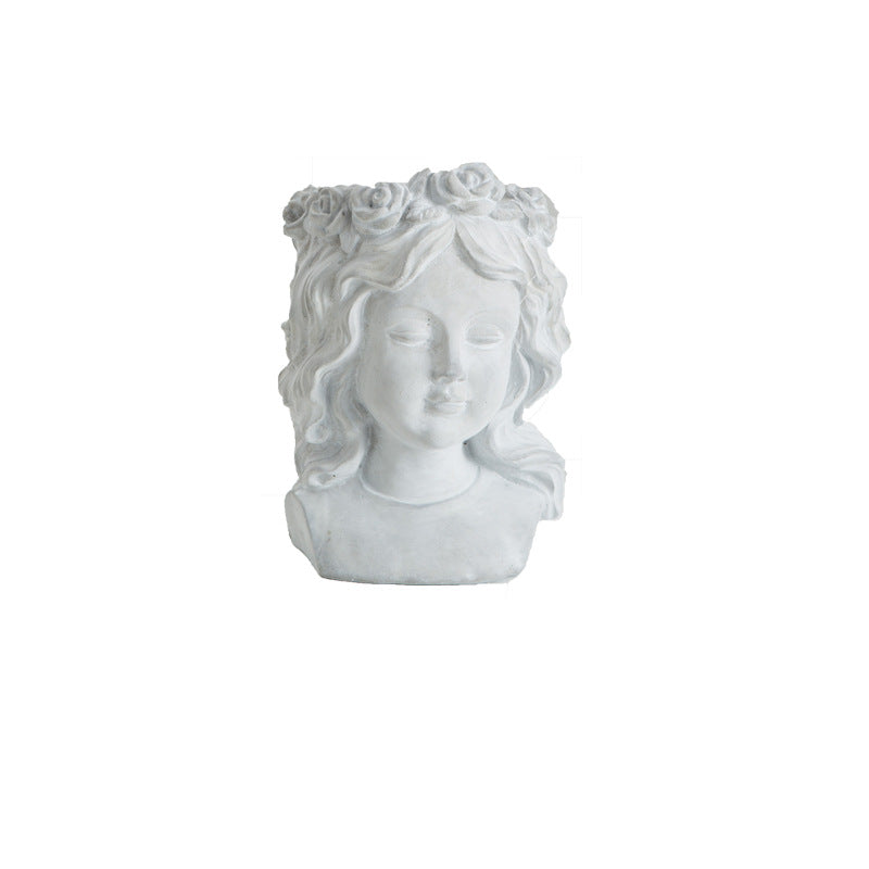 Artistic head sculpture flower pot