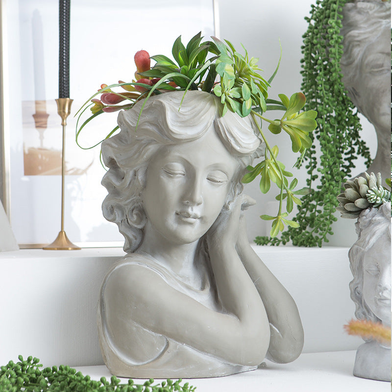 Artistic head sculpture flower pot