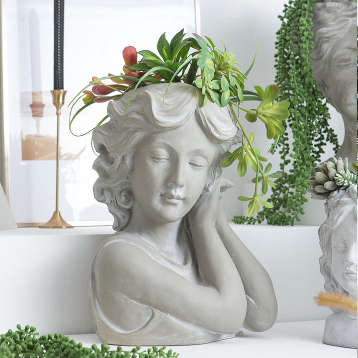 Artistic head sculpture flower pot