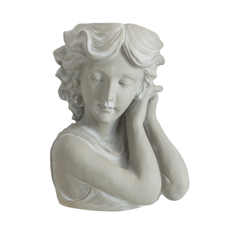 Artistic head sculpture flower pot