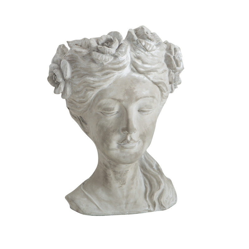 Artistic head sculpture flower pot