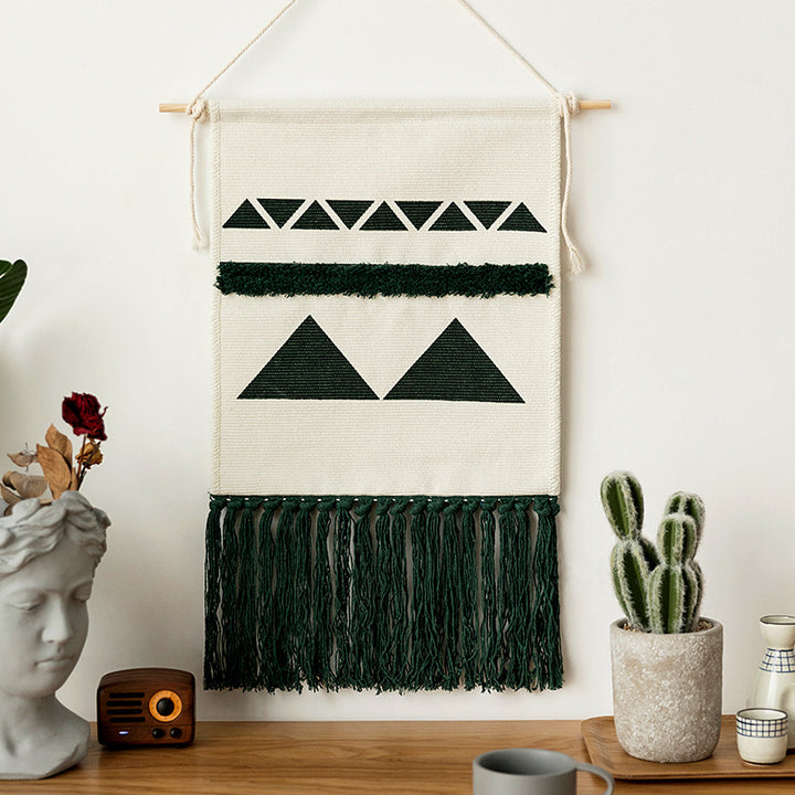 Hand-woven wall hanging and table runner made of cotton blend with geometric staircase pattern and long fringes