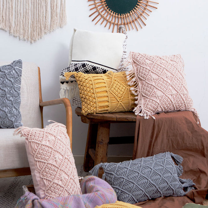 Rectangular cushion cover in macramé style with tufted floral appliqués and fringes