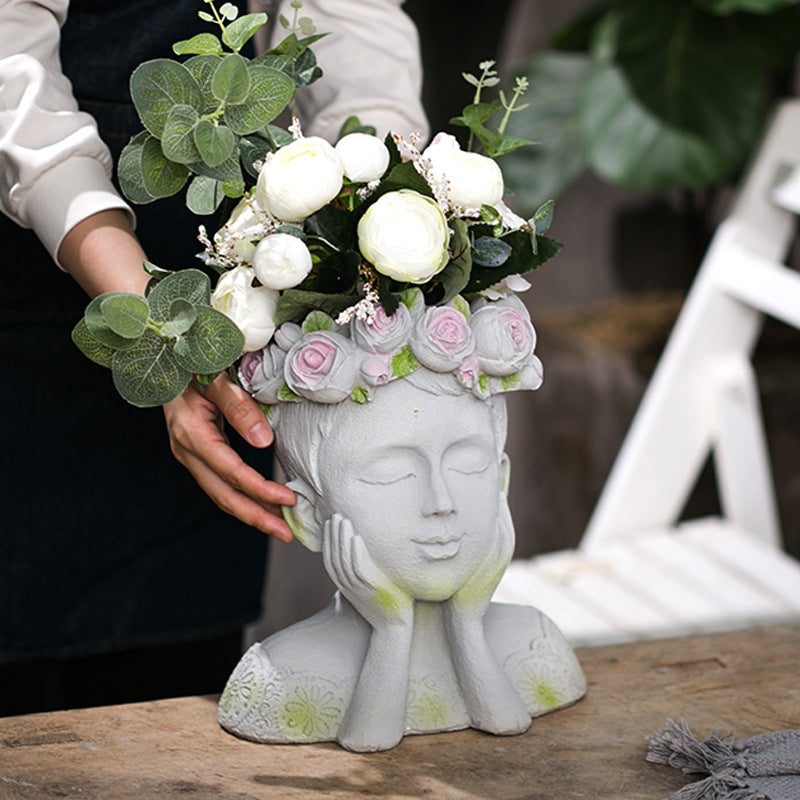 Decorative head with rosary