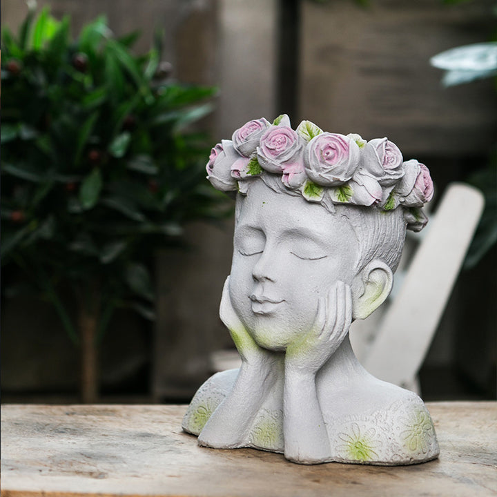 Decorative head with rosary