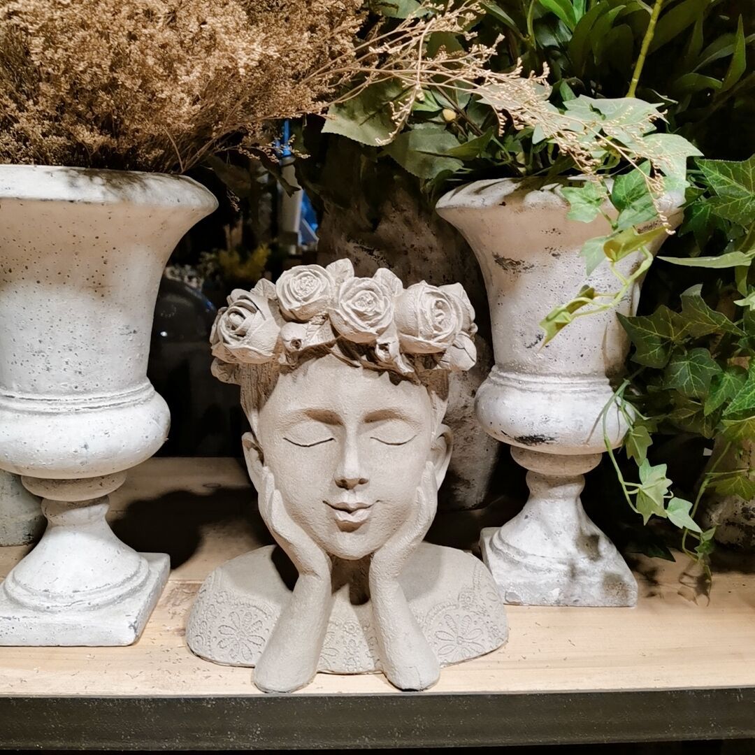 Decorative head with rosary