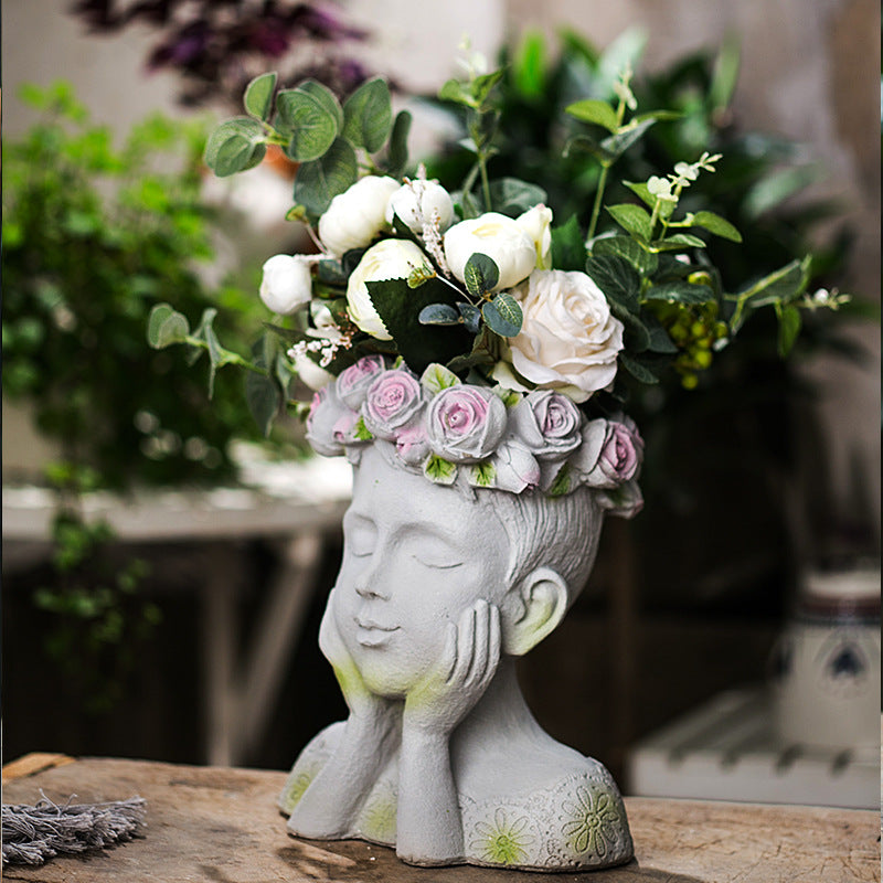 Decorative head with rosary
