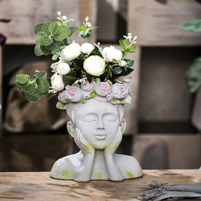 Decorative head with rosary