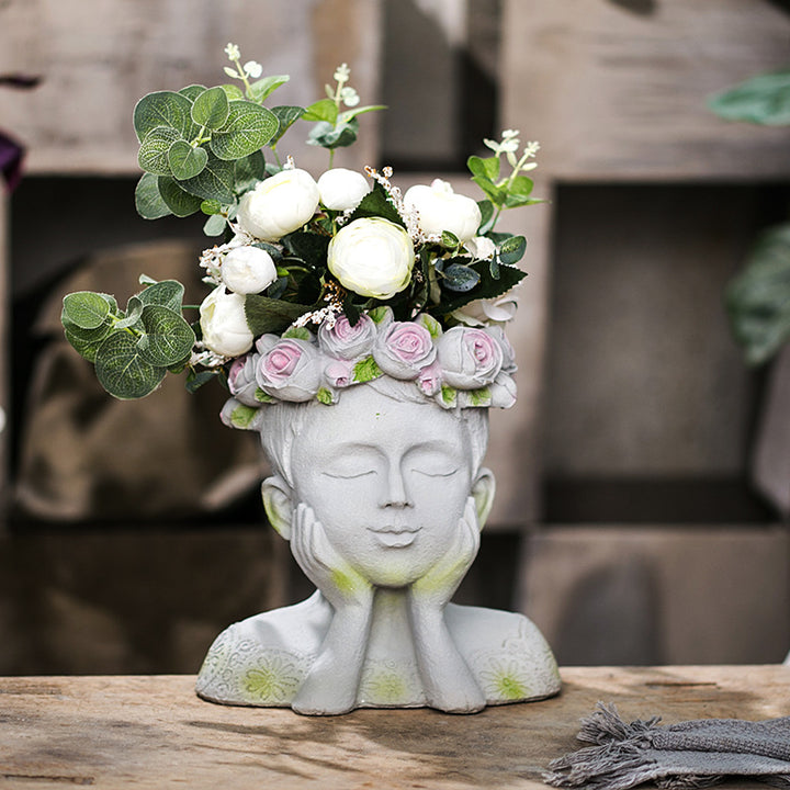 Decorative head with rosary