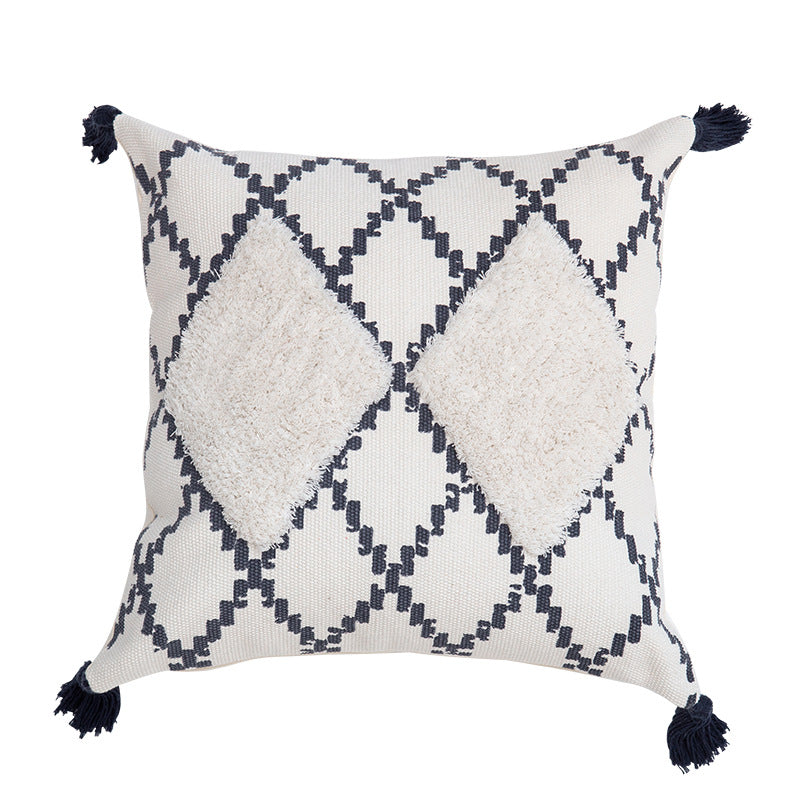 Decorative Boho cushion cover with hand-tufted diamond relief, tassels, and woven cotton blend