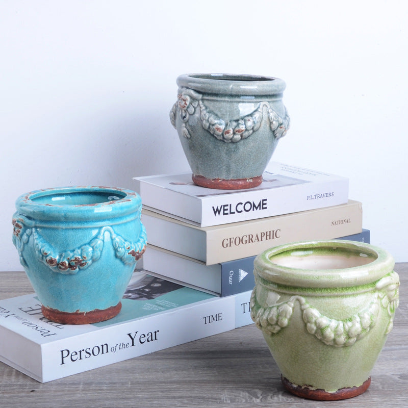 Decorative plant pot with artistic relief