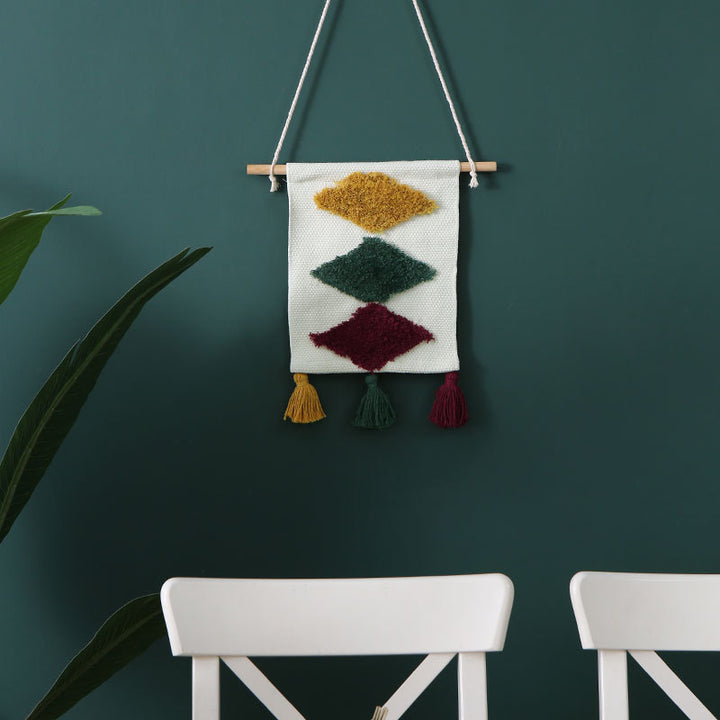 Woven wall hanging with hand-tufted rainbow design, cotton blend and decorative tassels