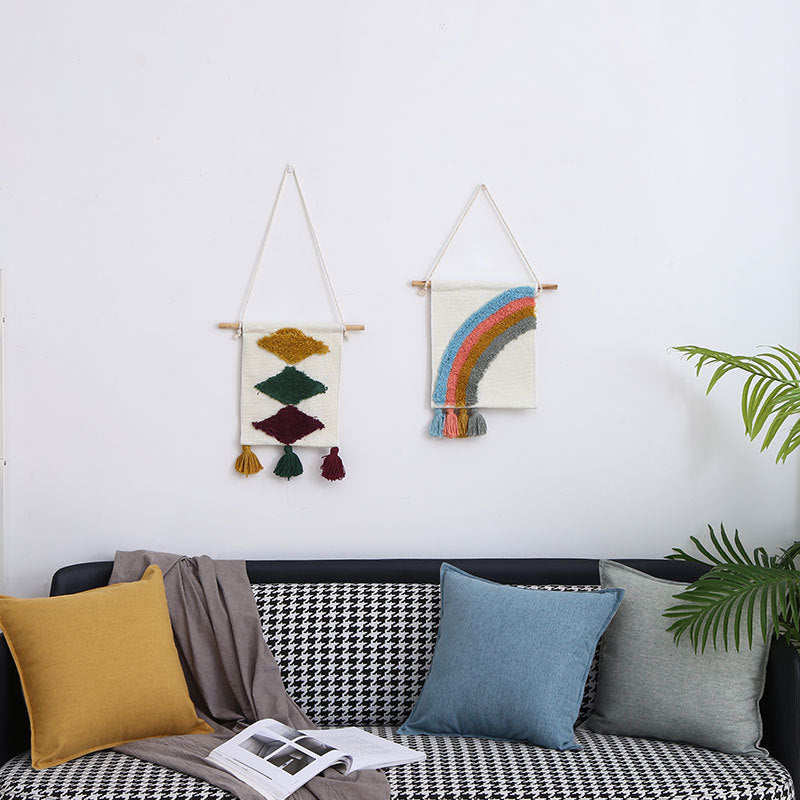 Woven wall hanging with hand-tufted rainbow design, cotton blend and decorative tassels