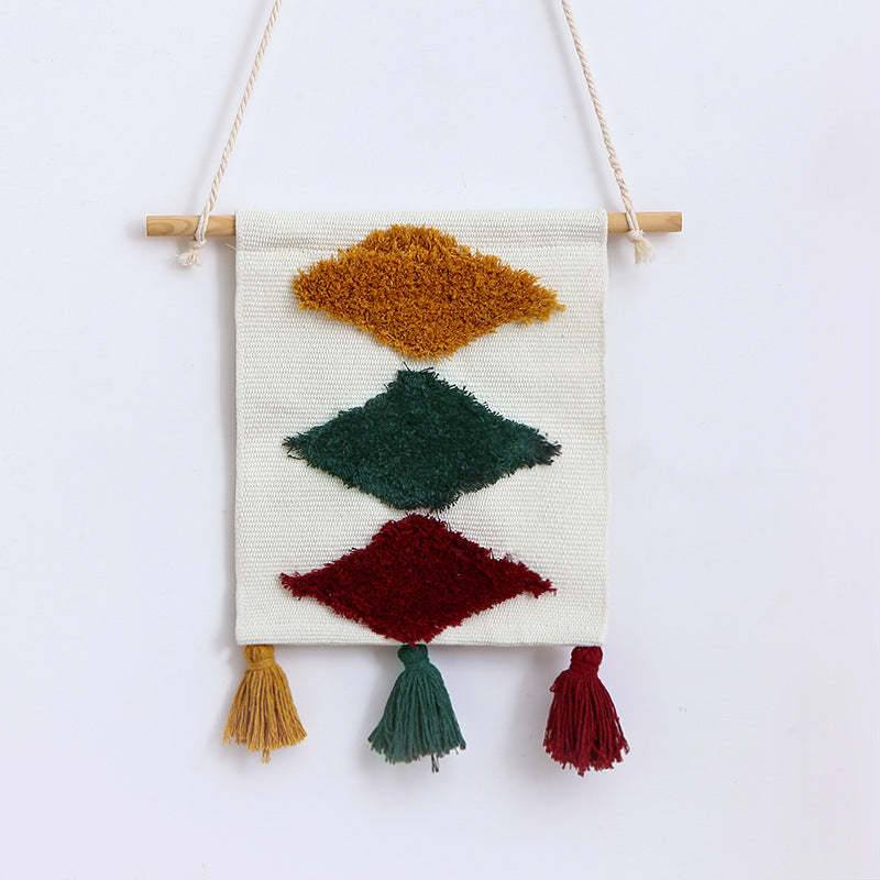 Woven wall hanging with hand-tufted rainbow design, cotton blend and decorative tassels