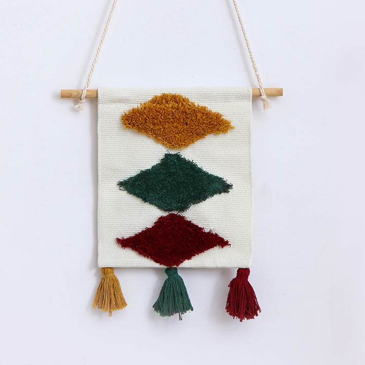 Woven wall hanging with hand-tufted rainbow design, cotton blend and decorative tassels