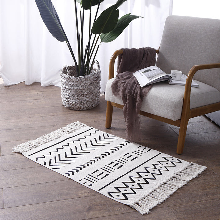 Flat-woven cotton runner with Boho-Ethno motif and decorative fringes