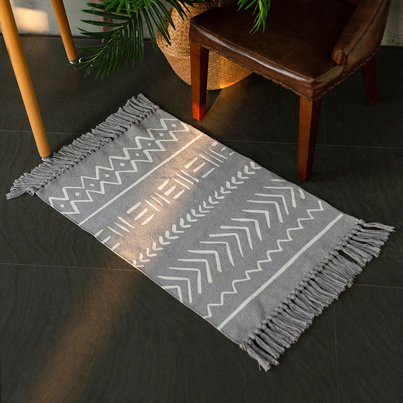 Flat-woven cotton runner with Boho-Ethno motif and decorative fringes