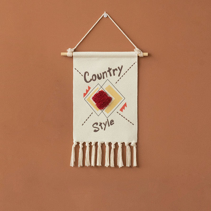 Decorative wall tapestry made of cotton with geometric ethnic pattern and tassels