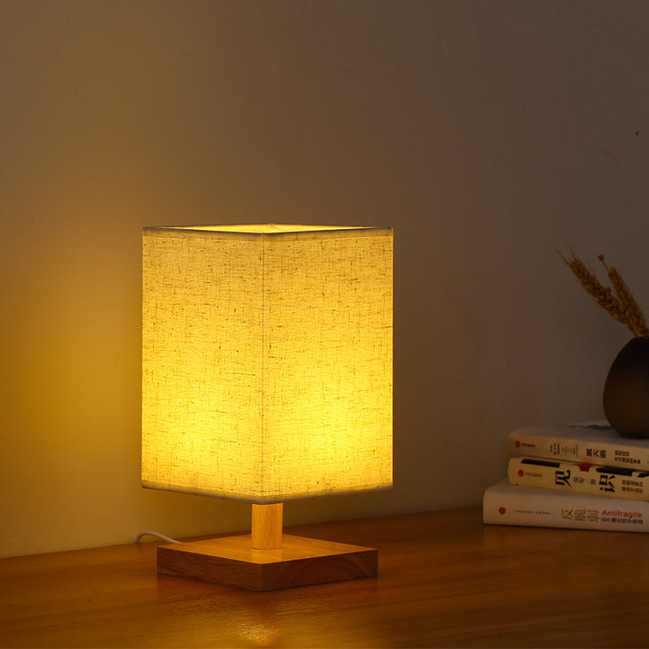 Compact Scandinavian wooden foot table lamp with linen lampshade