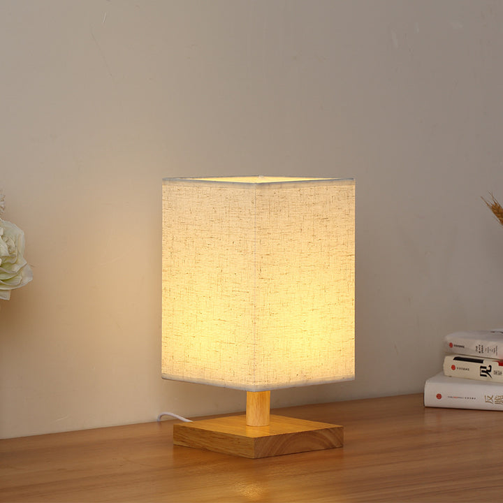 Compact Scandinavian wooden foot table lamp with linen lampshade