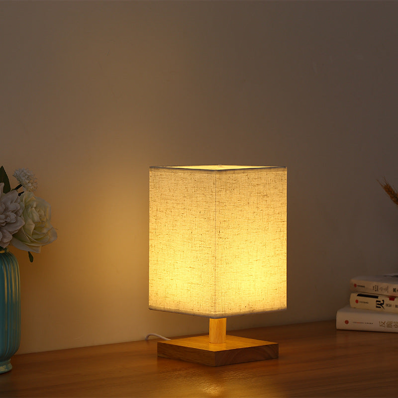 Compact Scandinavian wooden foot table lamp with linen lampshade
