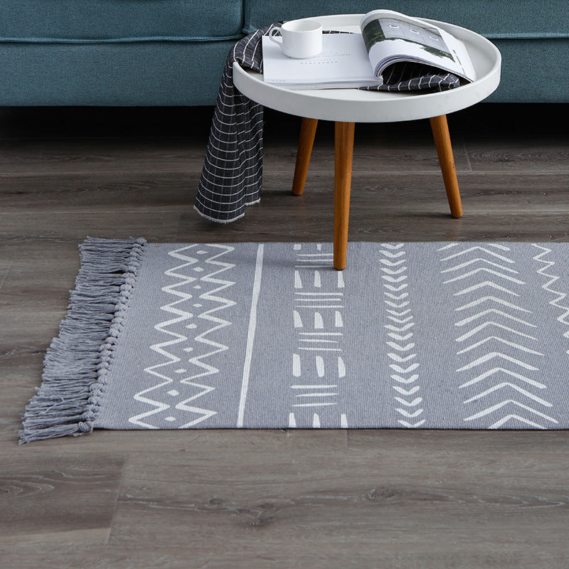 Flat-woven cotton runner with Boho-Ethno motif and decorative fringes